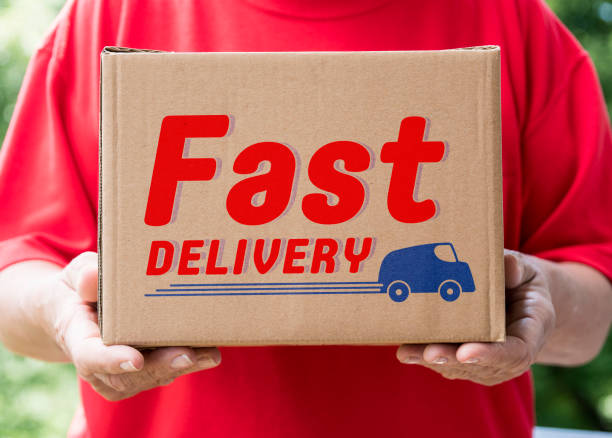Shipping box delivered by hand with “Fast delivery" text